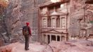 A man admiring the beauty of Petra — planning a trip to Jordan.