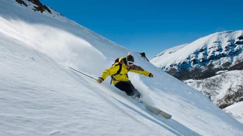 A man skiing in the snow of Andes in Patagonia in June.