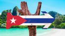 A wooden arrow with Cuban flag painted that you can see in Cuba in March.