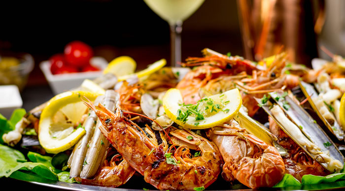 Seafood platter with a glass of white wine