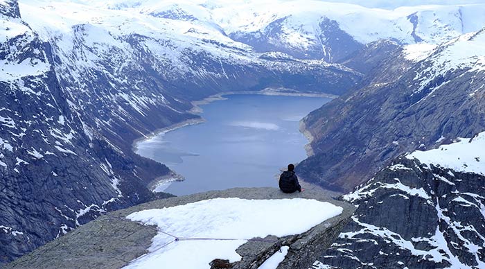 A solo traveler in the fjords of Norway